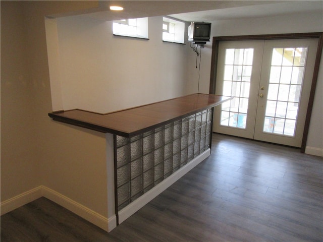 interior space with french doors, hardwood / wood-style floors, and a wealth of natural light