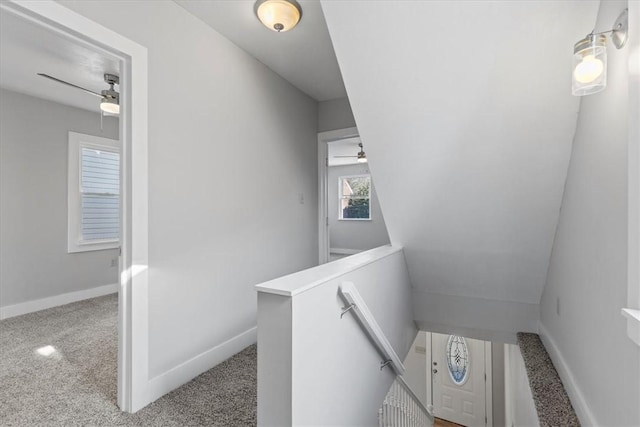 bathroom featuring ceiling fan and baseboards