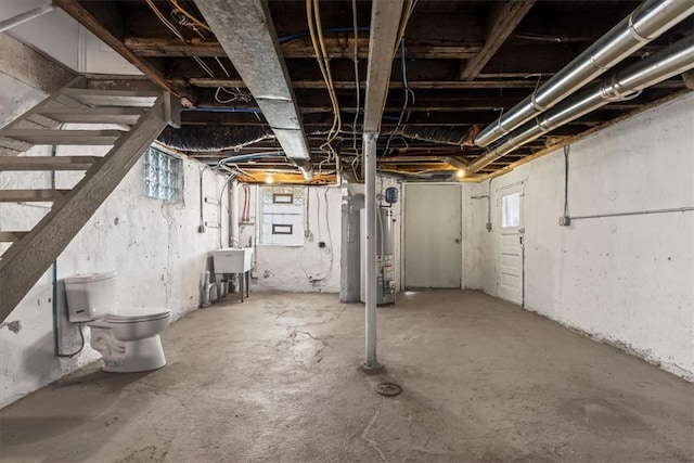 basement with a sink and gas water heater