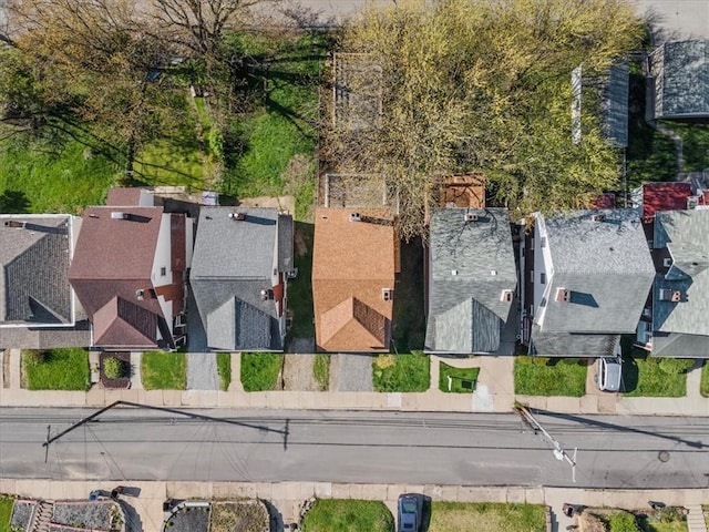 birds eye view of property with a residential view