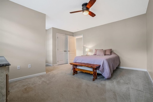 bedroom with ceiling fan and light carpet