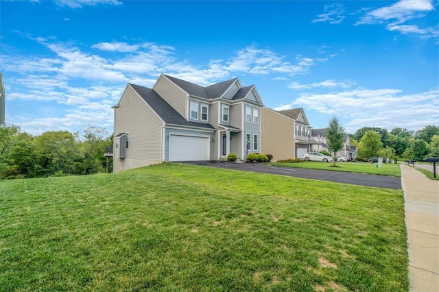 view of front of house with a front lawn and a garage