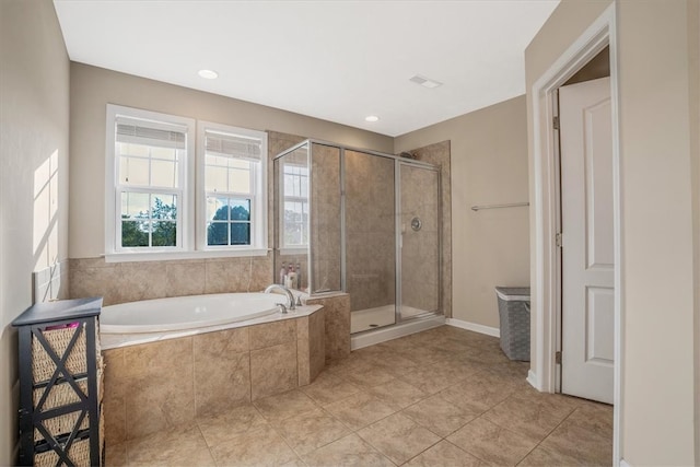 bathroom featuring tile patterned flooring and independent shower and bath