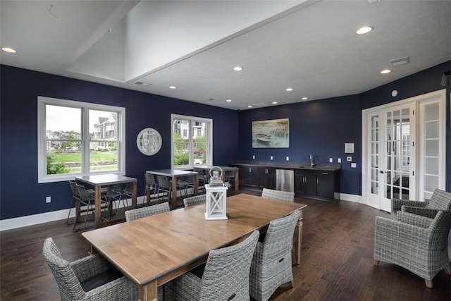 dining room with recessed lighting, dark wood-type flooring, visible vents, baseboards, and french doors