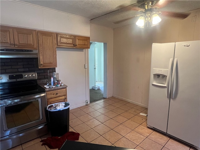 kitchen featuring tasteful backsplash, white fridge with ice dispenser, stainless steel electric range, range hood, and ceiling fan