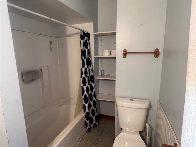 bathroom with toilet, shower / tub combo with curtain, and tile patterned flooring