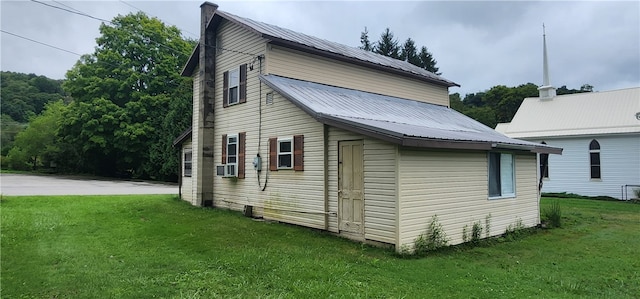 view of property exterior featuring a yard