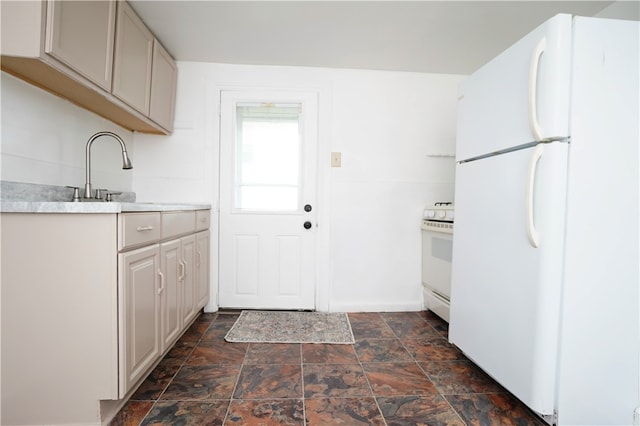 kitchen with white appliances and sink