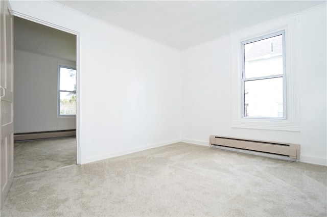 carpeted empty room featuring a baseboard radiator