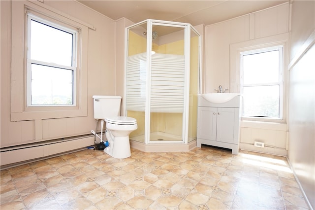 bathroom with a shower with door, vanity, a baseboard radiator, and toilet