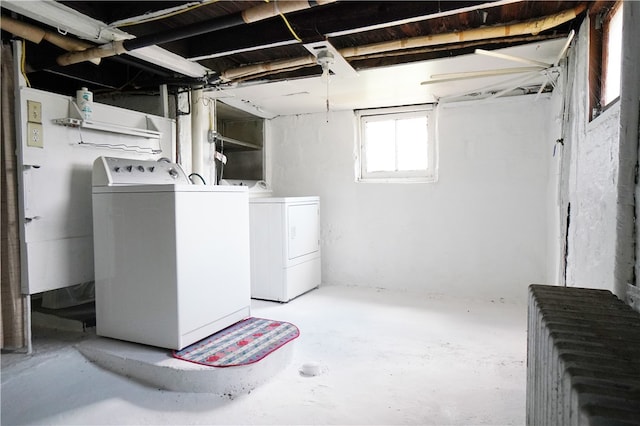 clothes washing area with washer and dryer