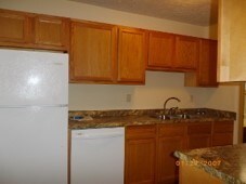 kitchen featuring white appliances and sink