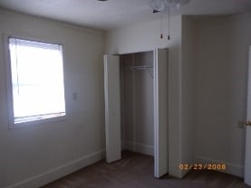 unfurnished bedroom featuring multiple windows