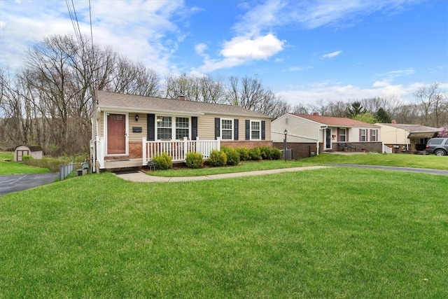 single story home featuring a front yard and covered porch