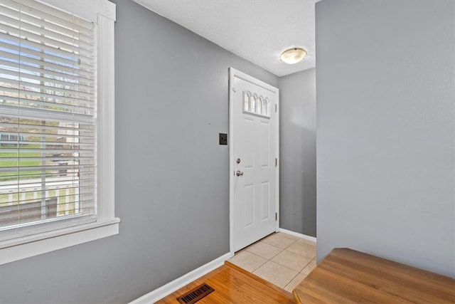 view of tiled foyer entrance