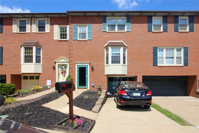 multi unit property featuring a garage