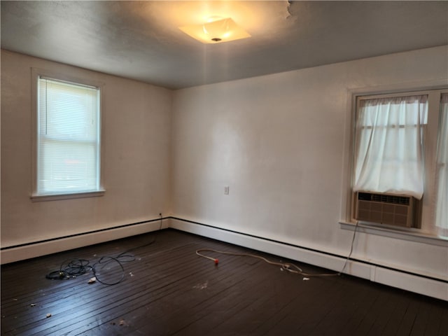 unfurnished room with baseboard heating, cooling unit, and hardwood / wood-style floors