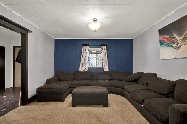 carpeted living room with ornamental molding