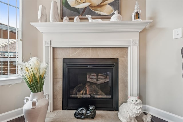 room details featuring a tiled fireplace