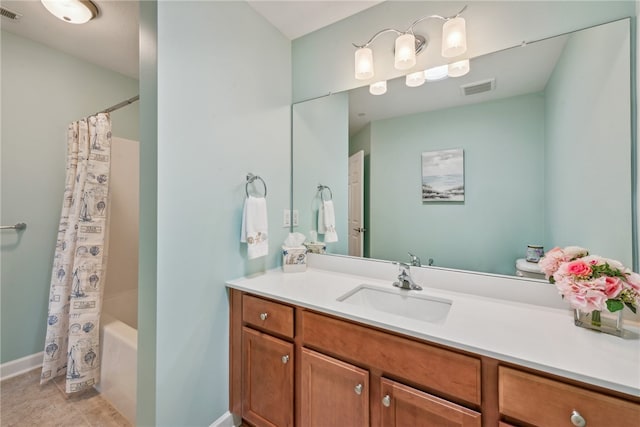 bathroom with shower / bath combination with curtain, tile patterned floors, and vanity