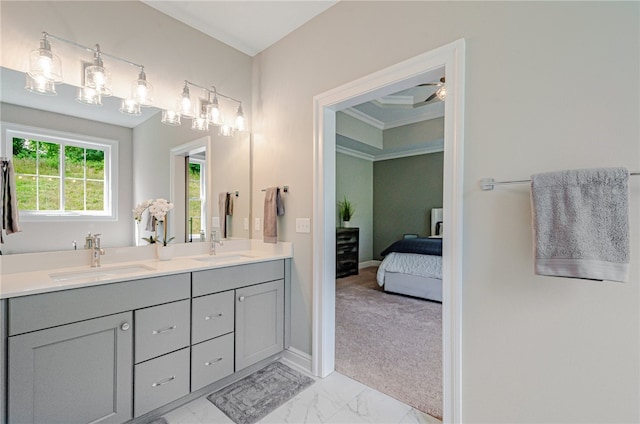 bathroom featuring ceiling fan, ornamental molding, double vanity, and tile patterned floors