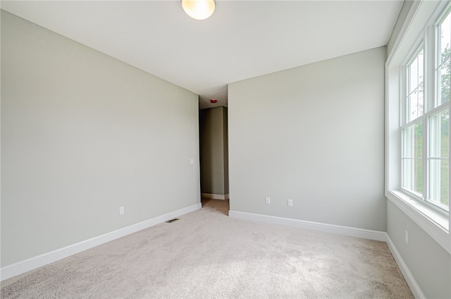 unfurnished room with carpet flooring