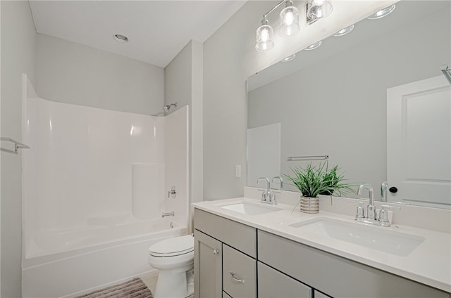 full bathroom featuring bathtub / shower combination, toilet, and double vanity