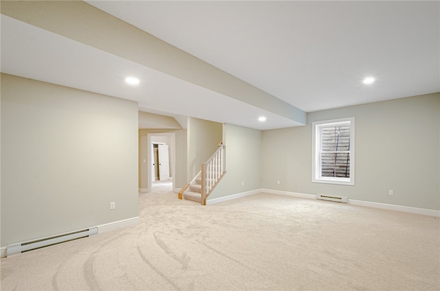 basement featuring a baseboard radiator and light carpet