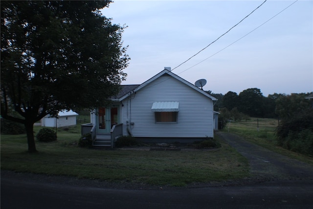 exterior space with a front lawn