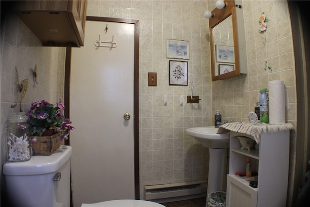 bathroom featuring tile walls and toilet