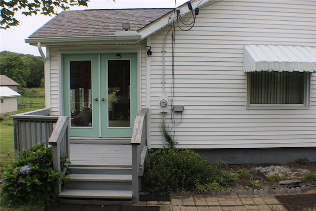 property entrance featuring french doors