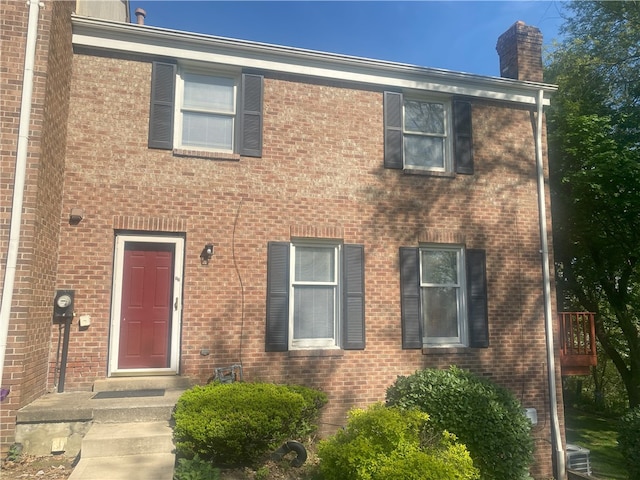 32 Bracken Pl, Plum Boro, PA 15239 - view of front of home with a chimney and brick siding
