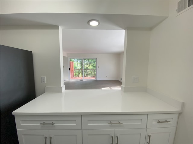 32 Bracken Pl, Plum Boro, PA 15239 - kitchen with freestanding refrigerator, white cabinets, light countertops, open floor plan, and recessed lighting