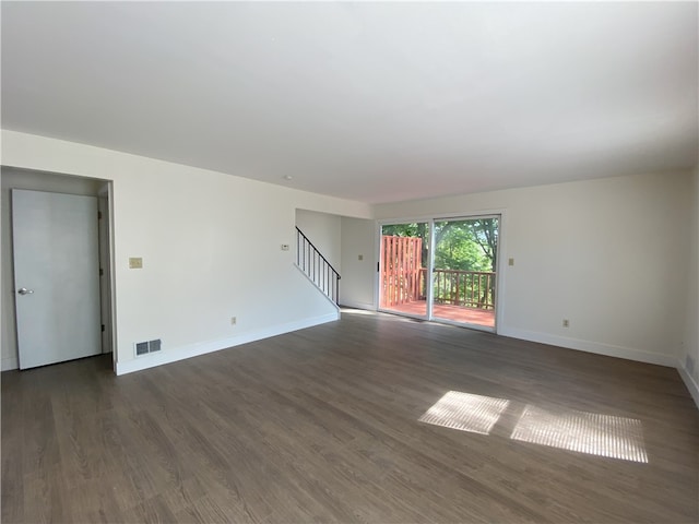 32 Bracken Pl, Plum Boro, PA 15239 - unfurnished living room with stairway, dark wood-style flooring, and baseboards