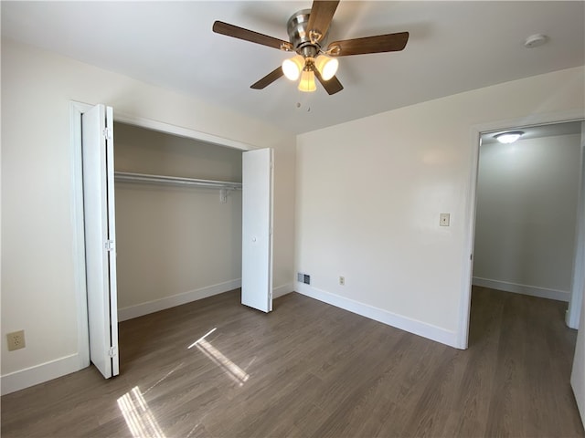 unfurnished bedroom with a closet, ceiling fan, and hardwood / wood-style floors