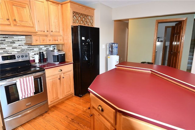 kitchen with black refrigerator with ice dispenser, light hardwood / wood-style flooring, tasteful backsplash, stainless steel electric range, and light brown cabinets