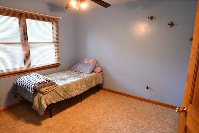 bedroom featuring ceiling fan and carpet flooring