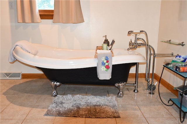 bathroom with tile patterned flooring