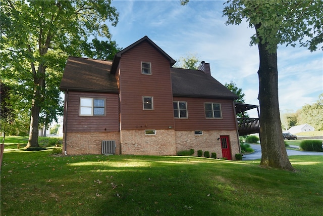 exterior space featuring a wooden deck and a yard