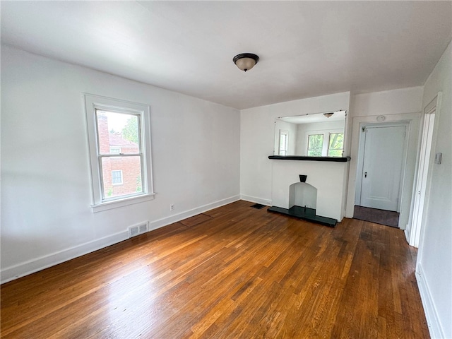 spare room with wood-type flooring