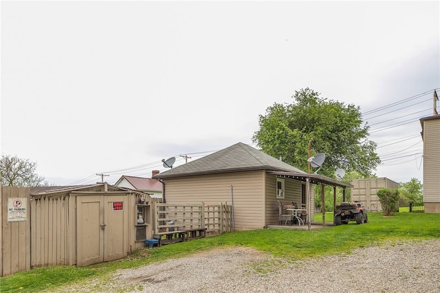 view of side of home with a storage unit