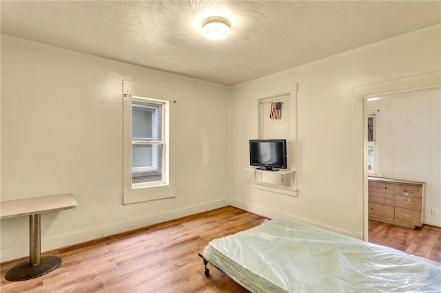 bedroom with light hardwood / wood-style flooring