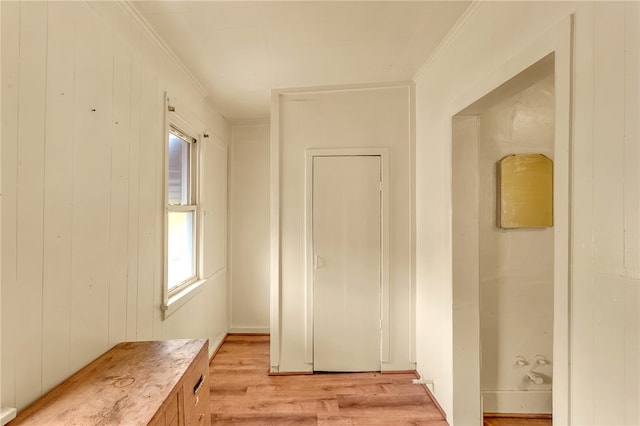 interior space featuring light hardwood / wood-style floors and ornamental molding