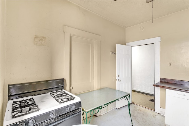 kitchen featuring a textured ceiling and range