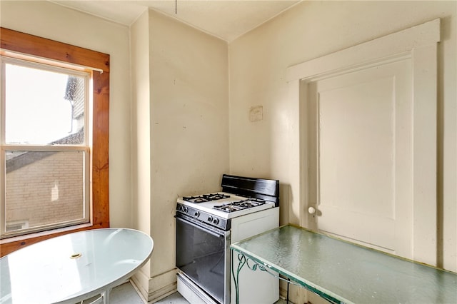 kitchen with white gas stove