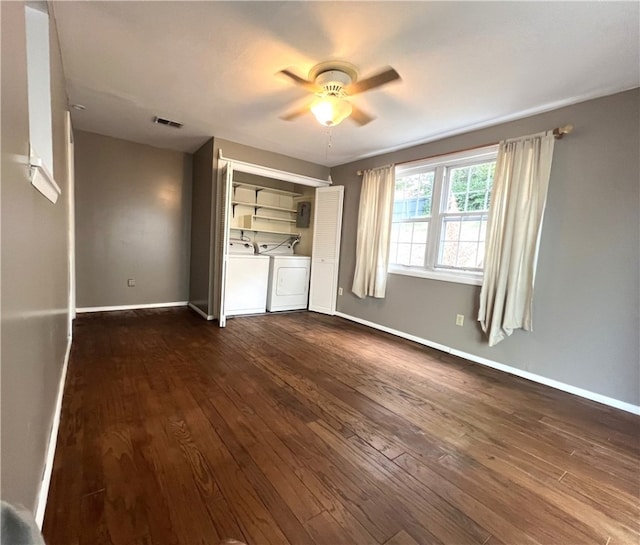 unfurnished bedroom featuring ceiling fan, washing machine and dryer, a closet, and wood-type flooring