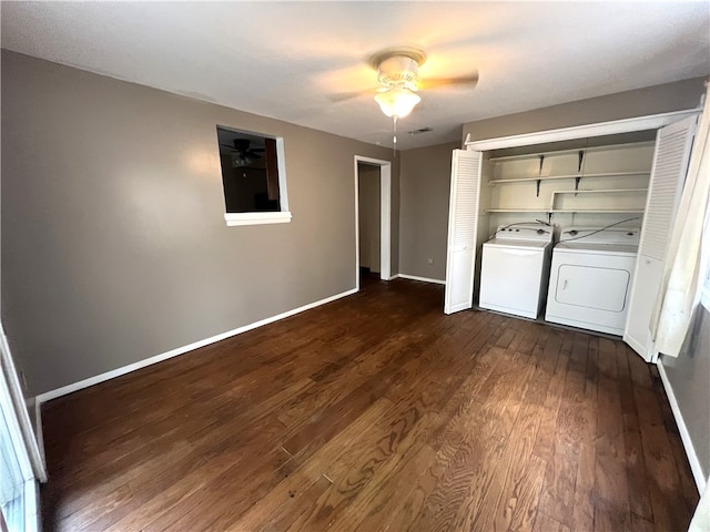 unfurnished bedroom featuring dark hardwood / wood-style flooring, washing machine and dryer, a closet, and ceiling fan