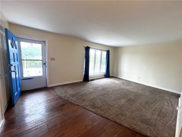 spare room featuring dark hardwood / wood-style floors