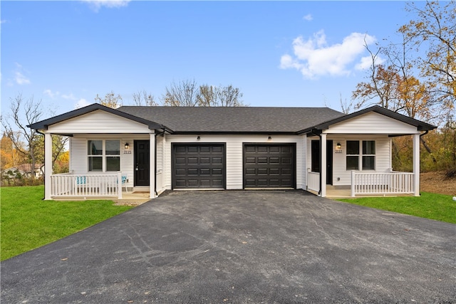 ranch-style home featuring a porch, a front lawn, and a garage