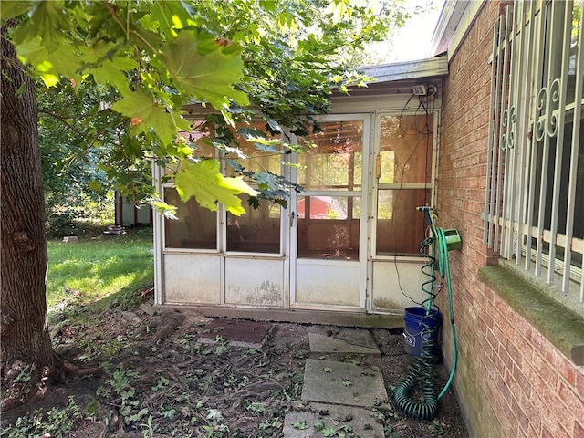 view of patio with a sunroom